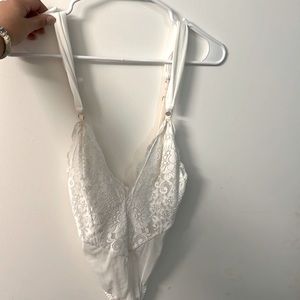 White plunge body suit